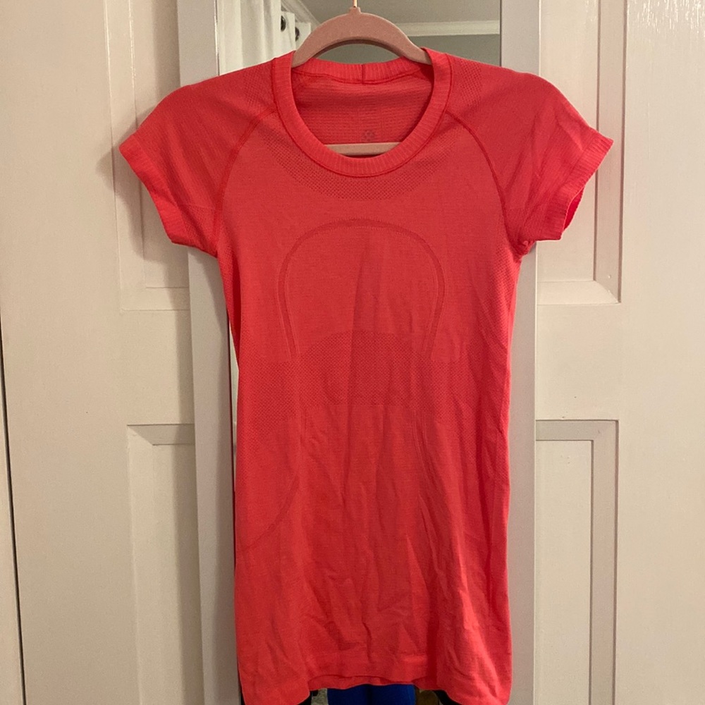 bright pink lululemon shirt